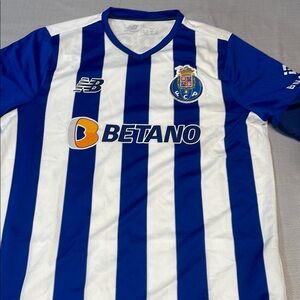 New Balance Kids Blue and White Striped Shirt JP-140